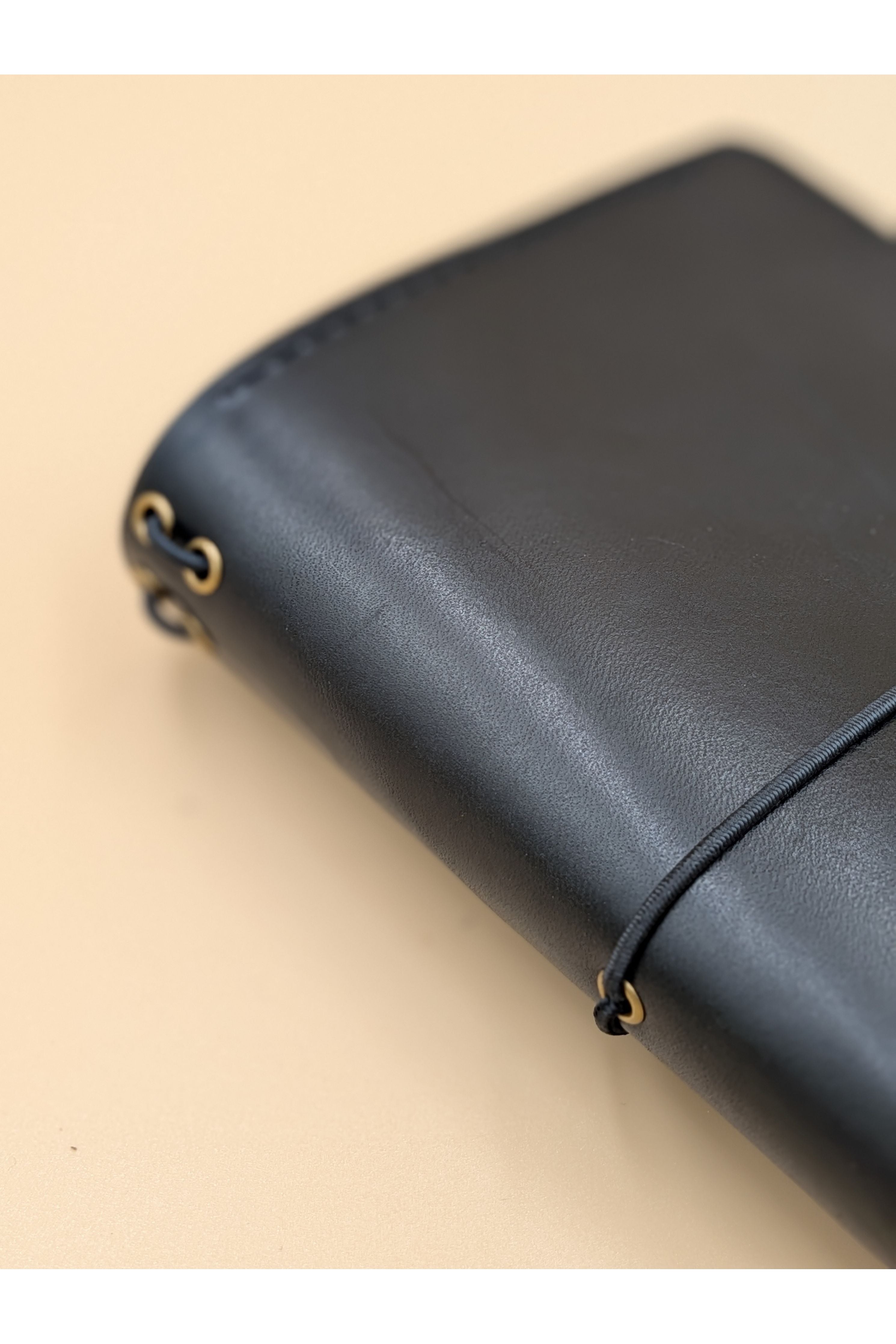 A6 bi-fold leather journal cover Jet Black colour side on view