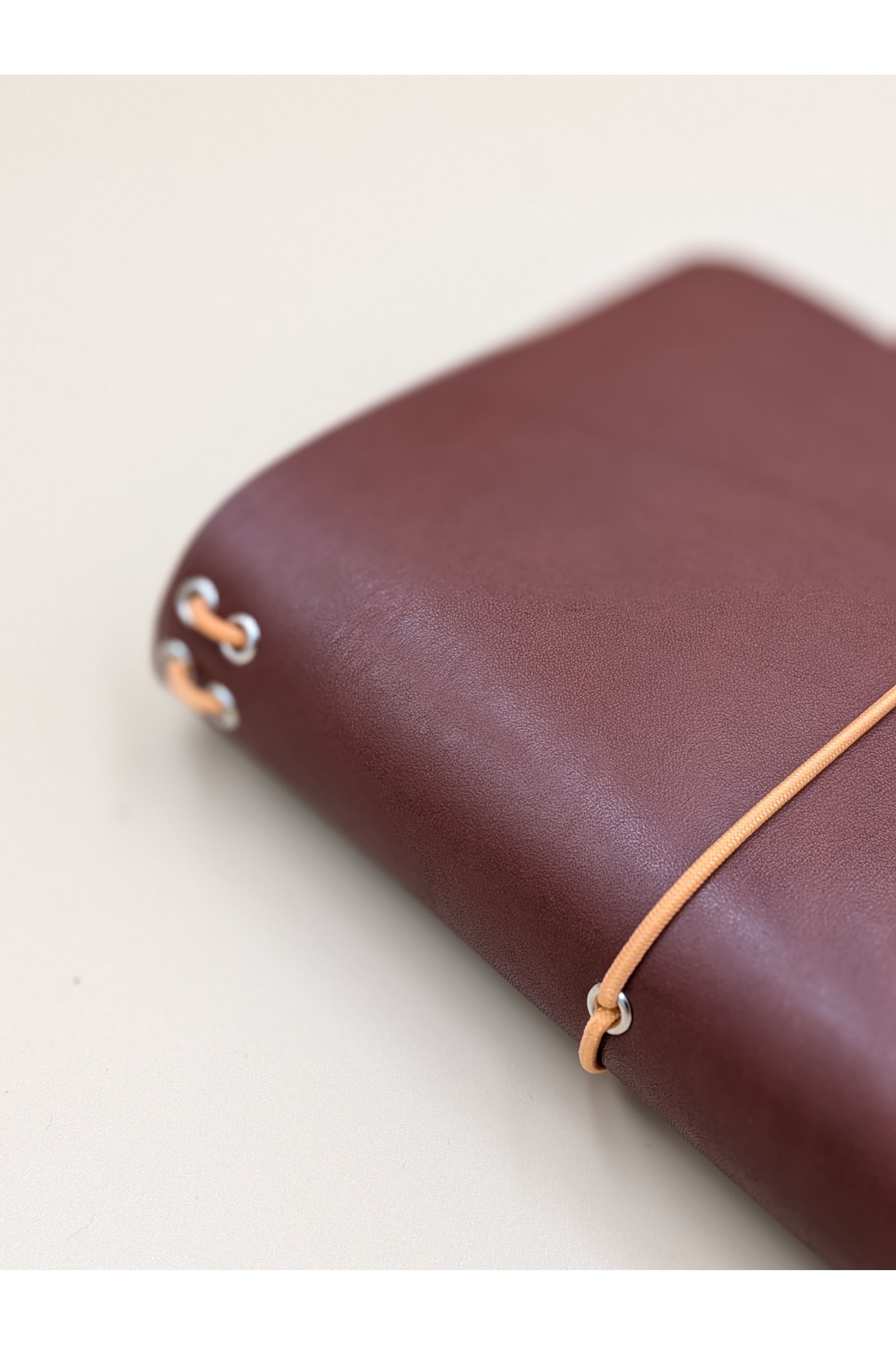 A6 leather journal cover Cognac colour side and spine view